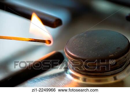 Matchstick lit the gasburner View Large Photo Image Stock Photograph - Matchstick lit the gasburner. Fotosearch