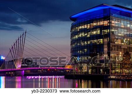 Media City Uk and The Media City Footbridge, Salford Quays, Manchester, England. View Large Photo Image Stock Image - Media City Uk and The Media City Footbridge, Salford Quays, Manchester, England.. Fotosearch