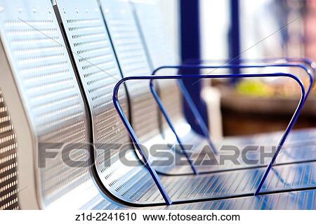 Stock Image - Metal seating at new railway station. Scotland.. Fotosearch