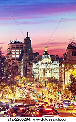 Metropolis building seen from Puerta de Alcala monument by sunset. Madrid, Spain. View Large Photo Image Picture - Metropolis building seen from Puerta de Alcala monument by sunset. Madrid, Spain.. Fotosearch
