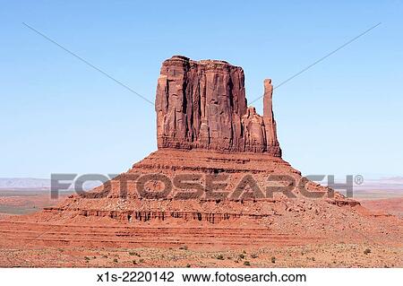 Stock Image - Monument Valley in the American Southwest is one of the most iconic and recognized landscapes in the world.. Fotosearch
