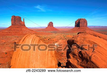 Stock Photo - Monument Valley Utah desert mittens in panoramic of Western landscape at sunset Natioanal Park.. Fotosearch