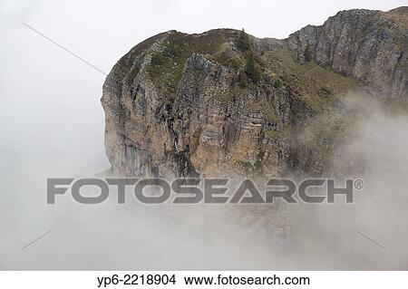 mountain with fog, Niederhorn, Bernese Oberland, Switzerland. View Large Photo Image Picture - mountain with fog, Niederhorn, Bernese Oberland, Switzerland.. Fotosearch