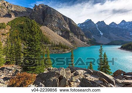 Stock Photograph - Mountains and Moraine Lake in the Banff National Park, Alberta, Canada. Fotosearch