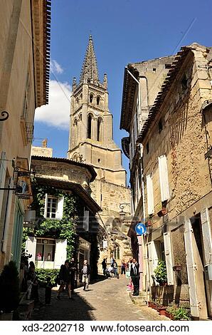 narrow street and Bell Tower of Monolith Church, St. Emilion, Gironde Department, Aquitaine, France. View Large Photo Image Stock Photo - narrow street and Bell Tower of Monolith Church, St. Emilion, Gironde Department, Aquitaine, France.. Fotosearch