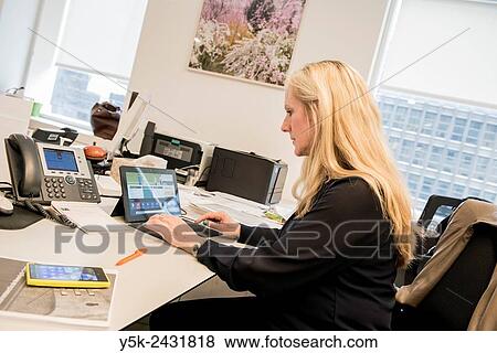 New York, USA. Consular employee at her office desk in the Dutch Consulate General, Manhattan. View Large Photo Image Stock Photo - New York, USA. Consular employee at her office desk in the Dutch Consulate General, Manhattan.. Fotosearch