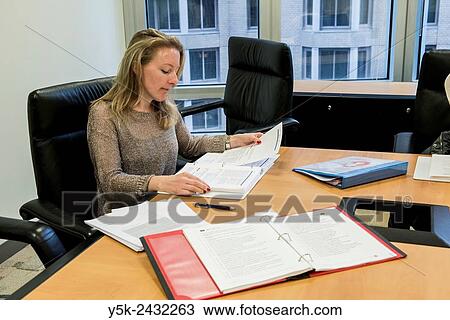 New York, USA. Female teacher at ´t Klokhuis, a school for Dutch language and culture, reading from her teaching readers during an instruction to het students. View Large Photo Image Stock Image - New York, USA. Female teacher at ´t Klokhuis, a school for Dutch language and culture, reading from her teaching readers during an instruction to het students.. Fotosearch