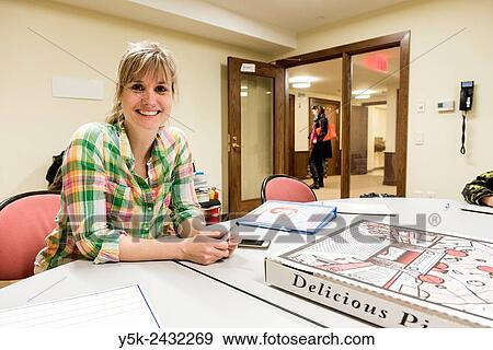 New York, USA. Female teacher at ´t Klokhuis, a school for Dutch language and culture, with her teaching materials during an instruction to students. View Large Photo Image Stock Photo - New York, USA. Female teacher at ´t Klokhuis, a school for Dutch language and culture, with her teaching materials during an instruction to students.. Fotosearch