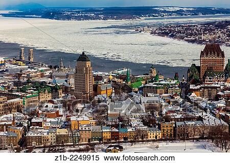 Stock Photography - Overview of Old Quebec City and ice on the St. Lawrence River.. Fotosearch