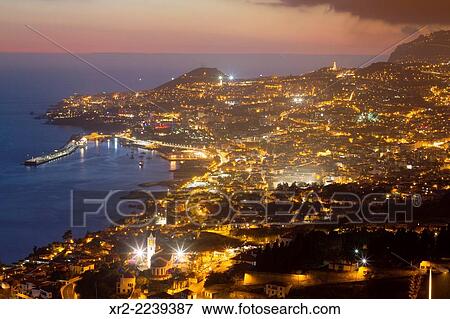 Panoramic view of Funchal at sunset from das Neves viewer, Madeira, Portugal. View Large Photo Image Stock Photo - Panoramic view of Funchal at sunset from das Neves viewer, Madeira, Portugal.. Fotosearch