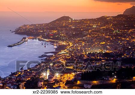 Panoramic view of Funchal at sunset from das Neves viewer, Madeira, Portugal. View Large Photo Image Stock Photography - Panoramic view of Funchal at sunset from das Neves viewer, Madeira, Portugal.. Fotosearch