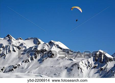 Paragliding over Swiss Alps, Bernese Alps, Fiescheralp, canton Valais, Switzerland. View Large Photo Image Picture - Paragliding over Swiss Alps, Bernese Alps, Fiescheralp, canton Valais, Switzerland.. Fotosearch