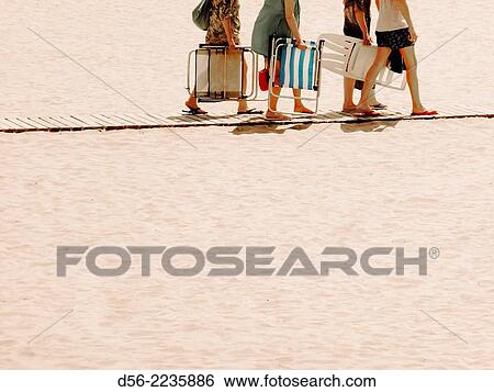 People going to the seashore, Poniente beach, Benidorm. View Large Photo Image Stock Photograph - People going to the seashore, Poniente beach, Benidorm.. Fotosearch