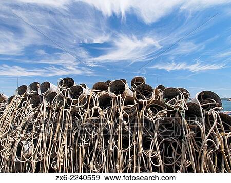 Pile of octopus plastic snares at Sant Carles de la Rapita fishing port. Ebro River Delta Natural Park, Tarragona province, Catalonia, Spain. View Large Photo Image Stock Photo - Pile of octopus plastic snares at Sant Carles de la Rapita fishing port. Ebro River Delta Natural Park, Tarragona province, Catalonia, Spain.. Fotosearch