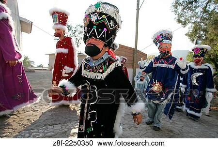Stock Image - Pilgrimage with musical band and colorful dreesed personages to visit Candelaria´s Virgin in Landa Guerrero Mexico. Every february the second this celebration comes to life, giving great reinforcement to the town individuality.. Fotosearch