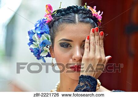 Portrait of a Latin woman inspired by the figure of Mexican painter Frieda Kahlo. View Large Photo Image Stock Photograph - Portrait of a Latin woman inspired by the figure of Mexican painter Frieda Kahlo.. Fotosearch
