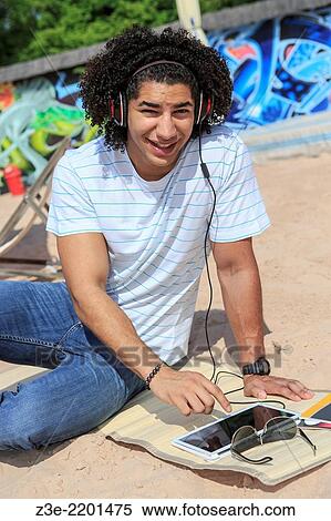 Portrait of a young man on the beach. View Large Photo Image Stock Photography - Portrait of a young man on the beach.. Fotosearch