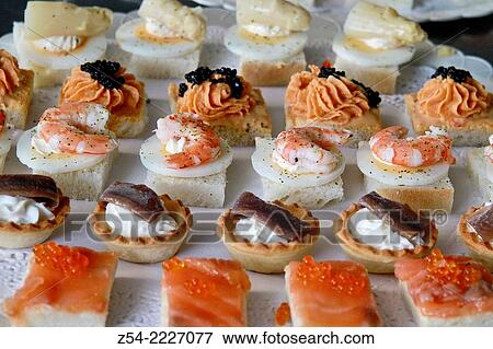 Prawn, anchovy, pink salmon, asparagus, caviar canapes. View Large Photo Image Stock Photo - Prawn, anchovy, pink salmon, asparagus, caviar canapes.. Fotosearch