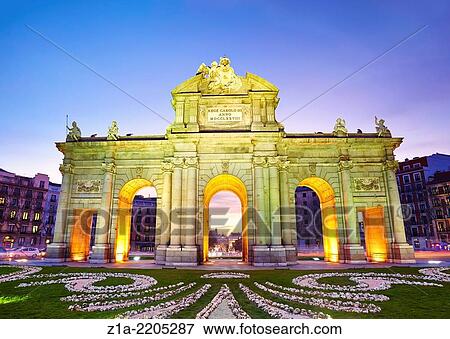 Stock Photo - Puerta de Alcala monument by sunset. Madrid, Spain.. Fotosearch