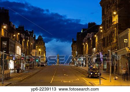 Stock Image - road in Edinburgh at night, Scotland.. Fotosearch