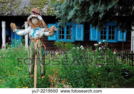 Scarecrow in front of very old wooden hut witch thatched roof. View Large Photo Image Stock Image - Scarecrow in front of very old wooden hut witch thatched roof.. Fotosearch