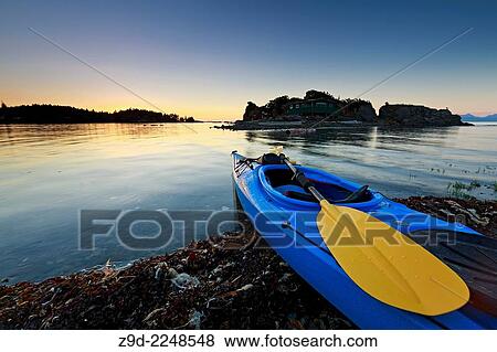 Stock Photo - Sea kayak at sunset, Pipers Lagoon Park, Nanaimo, Vancouver Island, British Columbia. Fotosearch