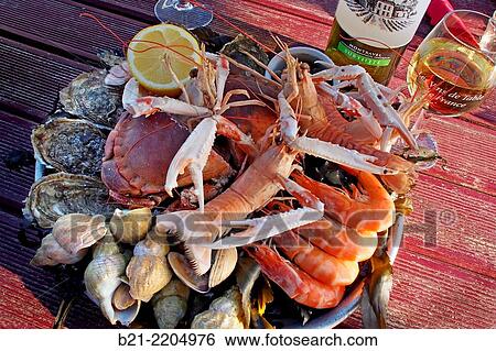 Seafood with Montravel dry white wine at Chez Huguette, Andernos, Bassin d´Arcachon, Gironde, Aquitaine, France View Large Photo Image Stock Photograph - Seafood with Montravel dry white wine at Chez Huguette, Andernos, Bassin d´Arcachon, Gironde, Aquitaine, France. Fotosearch