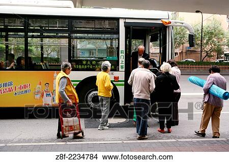 Shanghai, China: Residents board a local Shanghai bus. Shanghai is one of the most densely populated cities in China with over 24 million residents. View Large Photo Image Picture - Shanghai, China: Residents board a local Shanghai bus. Shanghai is one of the most densely populated cities in China with over 24 million residents.. Fotosearch