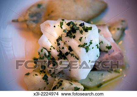Skrei, cod with artichokes. View Large Photo Image Picture - Skrei, cod with artichokes.. Fotosearch
