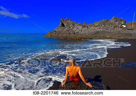 spain, canary islands, la palma: charco verde beach, bather. View Large Photo Image Stock Photograph - spain, canary islands, la palma: charco verde beach, bather.. Fotosearch