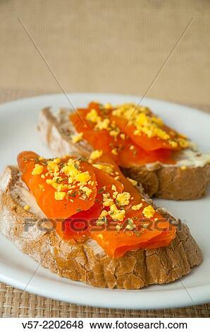 Spanish tapa: smoked salmon with cooked egg on toast. Spain. View Large Photo Image Stock Photo - Spanish tapa: smoked salmon with cooked egg on toast. Spain.. Fotosearch