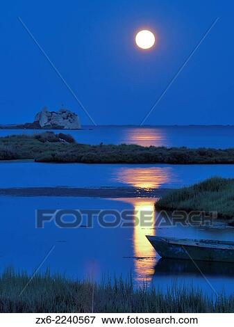 St. John tower ruins and small fishing boat under full moon at Alfacs Bay. Ebro River Delta Natural Park, Tarragona province, Catalonia, Spain. View Large Photo Image Stock Photo - St. John tower ruins and small fishing boat under full moon at Alfacs Bay. Ebro River Delta Natural Park, Tarragona province, Catalonia, Spain.. Fotosearch