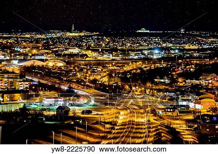 Stock Image - Starry night over Reykjavik and suburbs, Iceland.. Fotosearch