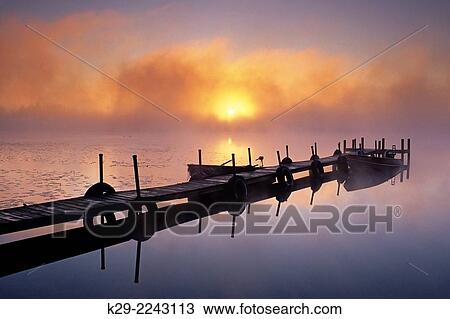 Sunrise over foggy Sand Lake, Sand Lake, Minnesota, USA. View Large Photo Image Stock Image - Sunrise over foggy Sand Lake, Sand Lake, Minnesota, USA.. Fotosearch