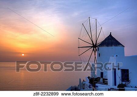 Sunset from Oia with a windmill, Oia, Santorini, Greece. View Large Photo Image Stock Photo - Sunset from Oia with a windmill, Oia, Santorini, Greece.. Fotosearch