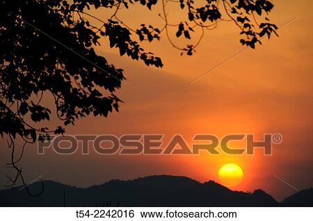 Sunset in Kanchanaburi, Thailand View Large Photo Image Stock Photograph - Sunset in Kanchanaburi, Thailand. Fotosearch