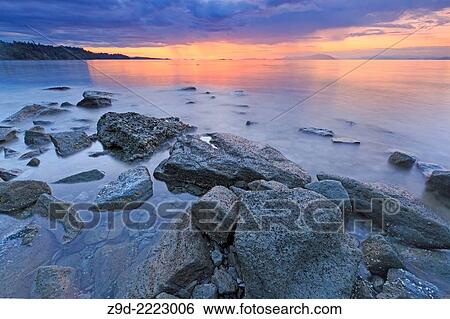Sunset over Georgia Strait from beach in north Nanaimo, Vancouver Island, British Columbia. View Large Photo Image Stock Photograph - Sunset over Georgia Strait from beach in north Nanaimo, Vancouver Island, British Columbia.. Fotosearch
