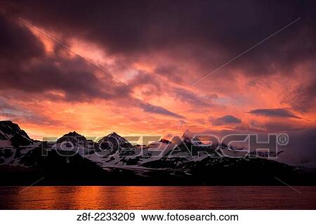 Stock Photo - Sunset sky over South Georgia Island, Antarctica.. Fotosearch