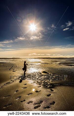 Stock Photograph - Taking pictures on the beach at Stokksnes, Eastern Iceland.. Fotosearch
