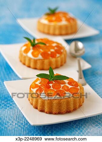 Tartlets with cheese and kumquats. View Large Photo Image Stock Photo - Tartlets with cheese and kumquats.. Fotosearch