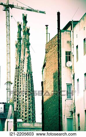 Temple of the Sagrada Familia by Antoni Gaudí between buildings. Barcelona, Catalonia, Spain. View Large Photo Image Stock Image - Temple of the Sagrada Familia by Antoni Gaudí between buildings. Barcelona, Catalonia, Spain.. Fotosearch
