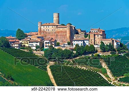 Stock Photo - The castle of Castiglione Falletto rising above vineyards, Castiglione Falletto, Province of Cuneo, Piedmont, Italy.. Fotosearch