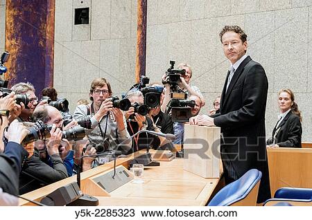 Stock Image - The Hague, Netherlands. The Dutch secretary / Minister of Finance, Mr. Jeroen Dijselbloem, offering the new, annual state budget for 2015 to the Second Chamber of Dutch Parliament.. Fotosearch