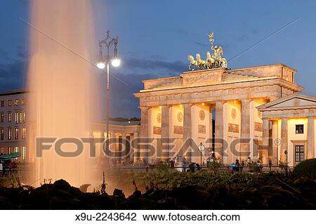 the illuminated Brandenburg Gate and fountain on Pariser Platz in Berlin, Germany, Europe. View Large Photo Image Stock Image - the illuminated Brandenburg Gate and fountain on Pariser Platz in Berlin, Germany, Europe.. Fotosearch