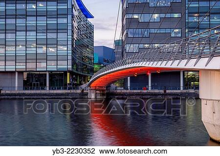 The Media City Footbridge and Media City Uk, Salford Quays, Manchester, England. View Large Photo Image Stock Image - The Media City Footbridge and Media City Uk, Salford Quays, Manchester, England.. Fotosearch