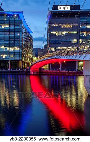 The Media City Footbridge and Media City Uk, Salford Quays, Manchester, England. View Large Photo Image Stock Photography - The Media City Footbridge and Media City Uk, Salford Quays, Manchester, England.. Fotosearch
