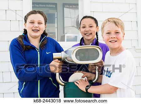 Three children, 12 years old, with a telescope at East Point, Saturna Island, Gulf Islands, BC, Canada View Large Photo Image Stock Photo - Three children, 12 years old, with a telescope at East Point, Saturna Island, Gulf Islands, BC, Canada. Fotosearch