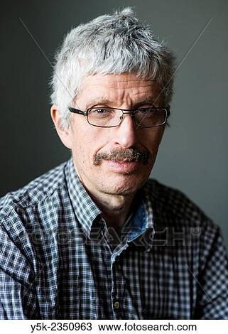 Tilburg, Netherlands. Studio portrait of a middle aged man wearing glasses and mustache. View Large Photo Image Stock Image - Tilburg, Netherlands. Studio portrait of a middle aged man wearing glasses and mustache.. Fotosearch