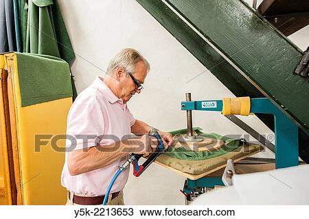 Tilburg, Netherlands. The 72 year old ´Boy´ still works as an independent upholsterer in his own workshop, down town Tilburg, where he refurbishes and upholsters all kinds of chairs. View Large Photo Image Stock Image - Tilburg, Netherlands. The 72 year old ´Boy´ still works as an independent upholsterer in his own workshop, down town Tilburg, where he refurbishes and upholsters all kinds of chairs.. Fotosearch