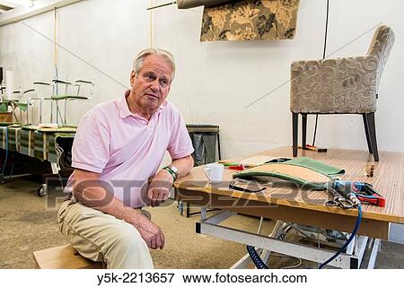 Tilburg, Netherlands. The 72 year old ´Boy´ still works as an independent upholsterer in his own workshop, down town Tilburg, where he refurbishes and upholsters all kinds of chairs. View Large Photo Image Stock Photo - Tilburg, Netherlands. The 72 year old ´Boy´ still works as an independent upholsterer in his own workshop, down town Tilburg, where he refurbishes and upholsters all kinds of chairs.. Fotosearch